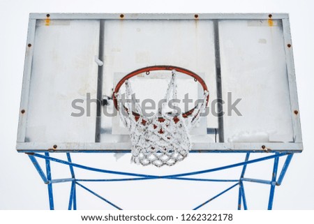 Basketball court covered with snow