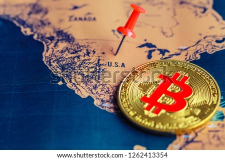 Red pin and bitcoin on USA (map). Regulations of cryptocurrency in United States concept.