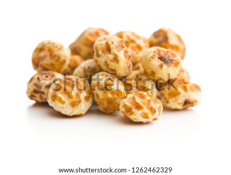 Tiger nuts. Tasty chufa nuts. Healthy superfood isolated on white background.