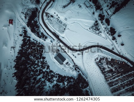 Beautiful aerial drone photo on winter park in cold season.Snowy landscape of Carpathian mountains in Europe.Travel destination for active holiday tourism