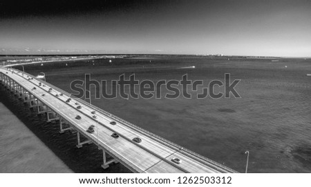 Aerial of Causeway with car traffic.