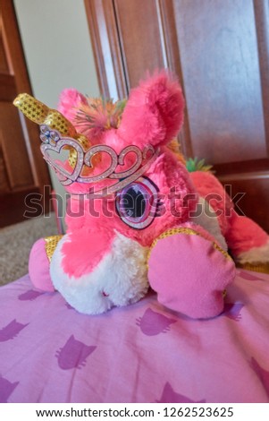 plush pink unicorn with tiara                