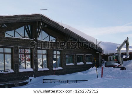 wooden house for skiers and snowboarders, winter snow mountains