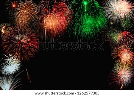 Fireworks of various color bursting against on  black background in festival holiday happy new year with copy space