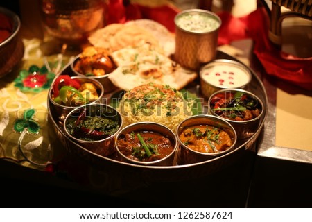 Indian platter thali - Indian food set Royalty-Free Stock Photo #1262587624