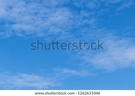 Beautiful  white  clouds  in  the  blue  sky  background