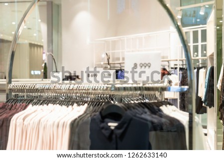 Sale off mock up advertise display frame setting over the clothes line in the shopping department store for shopping, business fashion and advertisement concept