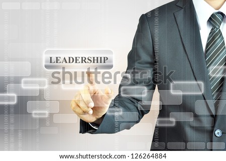Businessman touching Leadership sign
