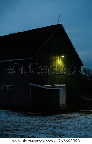 House with a green light in front Royalty-Free Stock Photo #1262668993