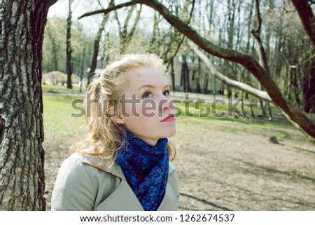 young pretty blonde girl enjoing spring nature in park, lifestyl