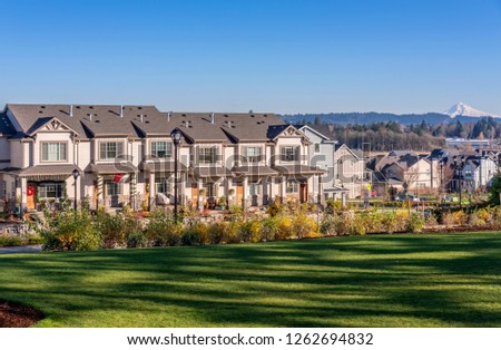 Row of townhouses and park in a neighborhood Wilsonville Oregon.