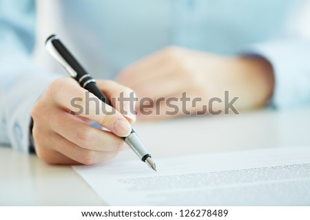Business worker signing the contract to conclude a deal Royalty-Free Stock Photo #126278489