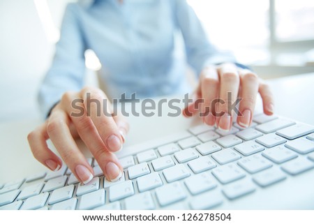 Busy secretary inputting data to the office computer Royalty-Free Stock Photo #126278504