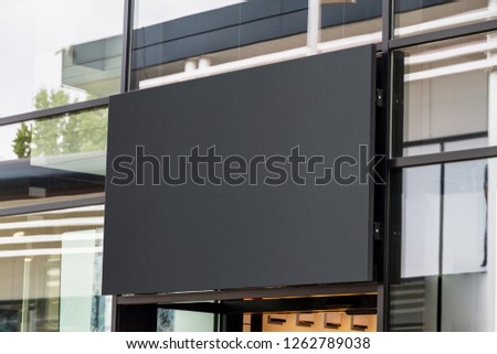 Outdoor horizontal sign on shop front window mockup