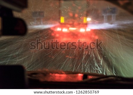 highway, driving at night during the blizzard