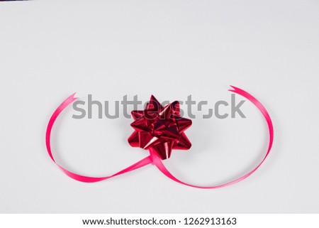 Pink  ribbon  isolated on a white background. 
For gift boxes, Christmas, New Year's Day, birthdays and other decorations.
