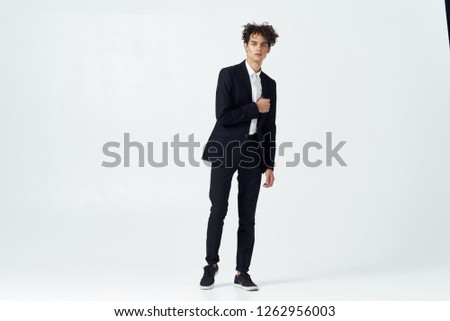 Curly handsome guy in a suit                    