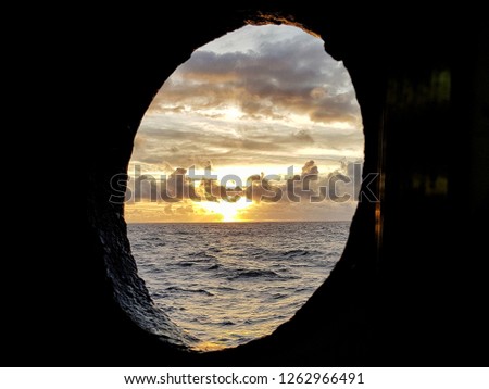 Sunrise seen through ships window. Moment captured in the middle of the Atlantic ocean. 