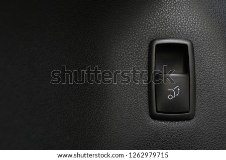Car trunk open closing button. Interior detail.