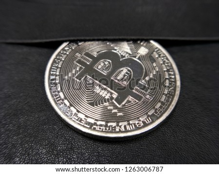 The silver bitcoin on pocket, Money on pocket