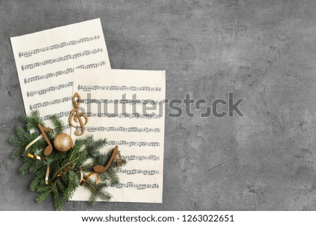 Composition with wooden music notes and space for text on grey background, top view