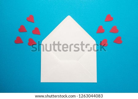  White envelope with hearts on blue background