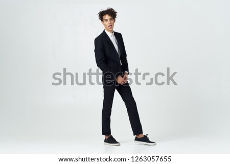 Handsome business man with curly hair in a suit               