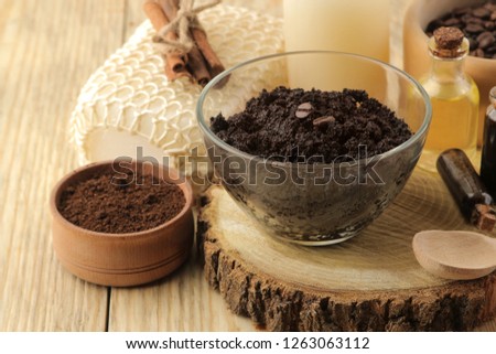homemade coffee scrub in the face and body bowl and various ingredients for making scrub on a wooden table. spa. cosmetics. care cosmetics.