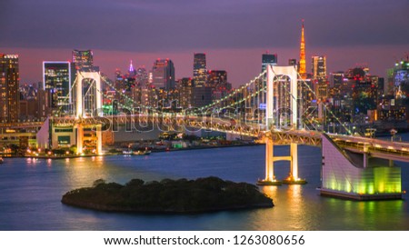 Romantic city night view of Odaiba, Tokyo , Rainbow bridge and Tokyo Tower landmark Twilight scene, Odaiba, Japan with selective focus.
