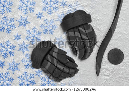 Color drawing on ice and hockey accessories. Concept, hockey, background, winter, wallpaper