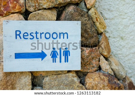 Signs to the restroom. 