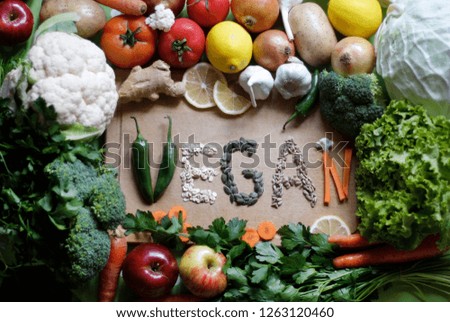 The word "VEGAN" written from vegetables and seeds 4