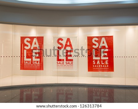 Sale sign text on wall in marketplace