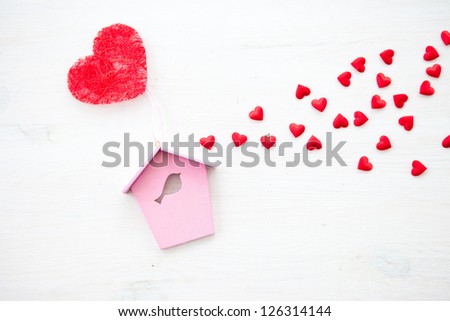White wooden background with hearts