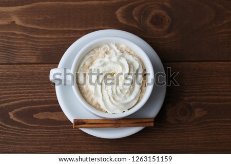 viennese coffee with whipped cream on wooden table