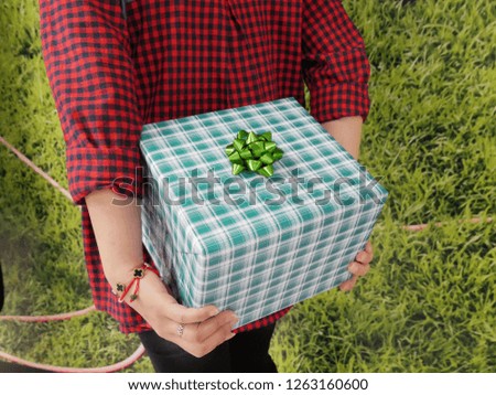 Gift Box in Women's Hand.