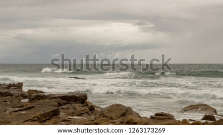 sea scene with passing storm 