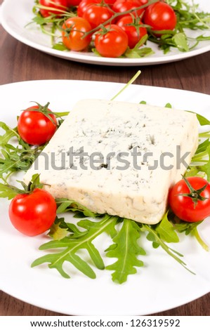 Cherry tomato and blue cheese on the plate