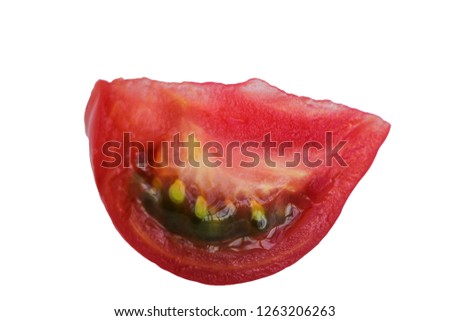Slice of juicy grainy tomato on white isolated background.
