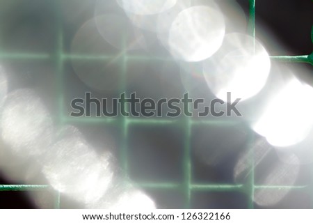 Abstract closeup shot flares and metal mesh