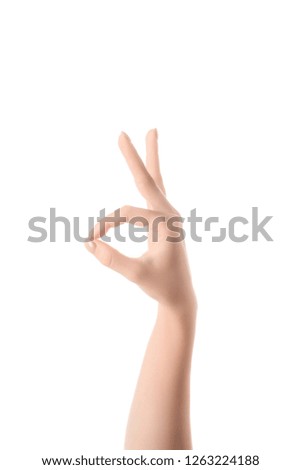 cropped view of woman showing ok sign isolated on white
