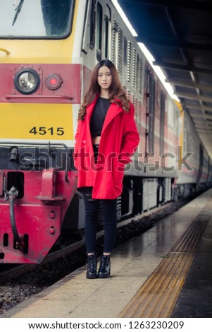 asia thai teen red coat in train station