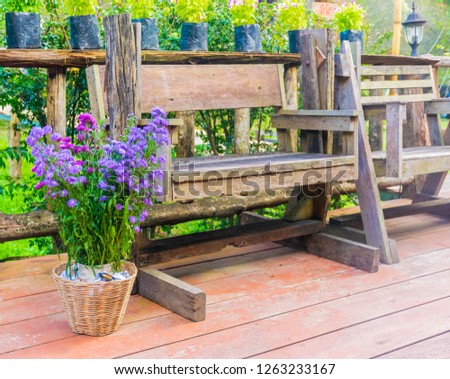 Rocking chair for Sit on the terrace in a comfortable area and have a tree decorated for beauty and relaxation.