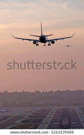 Commercial passenger jet landing at San Diego's Lindbergh Field airport in Southern California