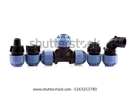 fittings for polyethylene pipes.compression couplings and fittings for polyethylene pipes.adjustable wrench for plumbing pipes and fittings Royalty-Free Stock Photo #1263253780