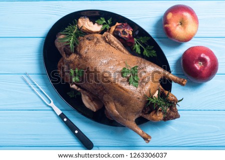 Roast baked duck . Christmas food on wooden background