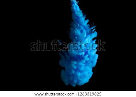paint stream in water, colored ink cloud, abstract background, blue dye on a black background