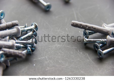 Plastic Anchors Bolts.Set of building tools. wall plugs as background, dowels.