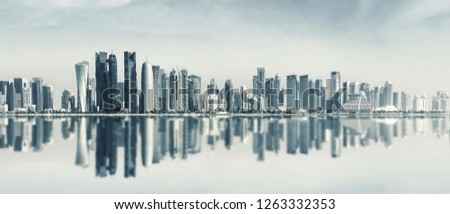 Futuristic urban skyline of Doha, Qatar. Doha is the capital and largest city of the Arab state of Qatar. Panoramic landscape of West bay Royalty-Free Stock Photo #1263332353
