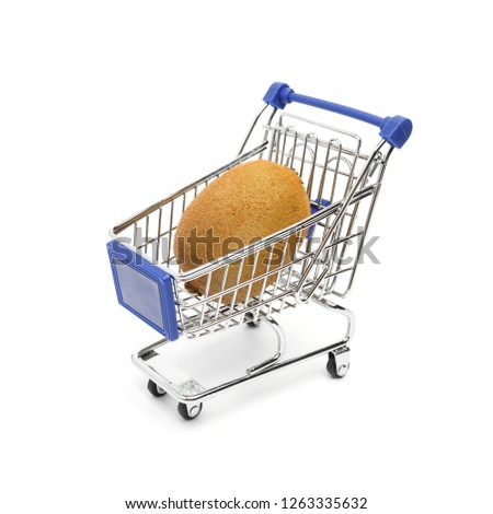 Beautiful ripe kiwi fruit lies in a shopping cart isolated on a white background. Conceptual image